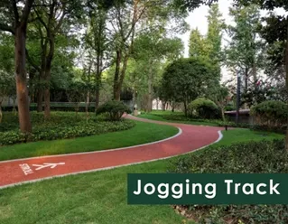 Well-designed jogging track surrounded by greenery at Shraddha Park City